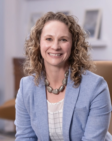 portrait of a smiling person in professional attire